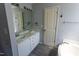 Spacious bathroom with dual sinks, a large mirror, and a soaking tub at 328 Mccarthy Dr, Clayton, NC 27527