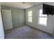 Simple bedroom featuring wainscotting, two windows, and an attached TV at 328 Mccarthy Dr, Clayton, NC 27527