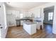 Bright kitchen featuring updated cabinetry and island with stone countertop at 328 Mccarthy Dr, Clayton, NC 27527
