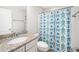 Bathroom with vanity, granite countertops, white cabinets, and a shower-tub combo at 3661 Manifest Pl, Cary, NC 27519