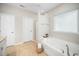 Well-lit bathroom features a soaking tub, separate shower, and ample storage at 3661 Manifest Pl, Cary, NC 27519