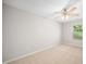 Comfortable bedroom features neutral carpet, ceiling fan, and a bright window at 3661 Manifest Pl, Cary, NC 27519