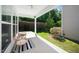 Cozy covered patio featuring comfortable seating and a view of the well-maintained backyard at 3661 Manifest Pl, Cary, NC 27519