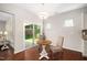 Cozy dining area with hardwood floors, chandelier, and sliding glass doors to the backyard at 3661 Manifest Pl, Cary, NC 27519