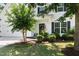 Inviting front porch with a black front door and verdant shrubbery at 3661 Manifest Pl, Cary, NC 27519