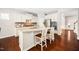 Well-appointed kitchen featuring granite countertops, stainless appliances, and a central island with seating at 3661 Manifest Pl, Cary, NC 27519