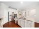 Modern kitchen with stainless steel refrigerator, granite countertops, and white cabinetry at 3661 Manifest Pl, Cary, NC 27519