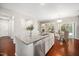 Open kitchen with granite island, stainless steel appliances, and a view to the living room at 3661 Manifest Pl, Cary, NC 27519
