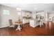 Open kitchen and dining area featuring granite countertops, stainless appliances, and a breakfast nook at 3661 Manifest Pl, Cary, NC 27519