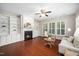 Inviting living room with hardwood floors, fireplace, built-in bookshelves, and bright windows at 3661 Manifest Pl, Cary, NC 27519