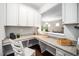 Office nook with granite countertops, custom cabinets, and wood floor at 3661 Manifest Pl, Cary, NC 27519