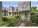 A lovely backyard offering a private retreat with a well-manicured lawn and a cozy porch for relaxation and outdoor enjoyment at 407 N Boylan Ave, Raleigh, NC 27603