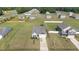 An aerial view of a residential area displaying neatly arranged homes with well-kept lawns and a suburban street layout at 41 Liam Dr, Broadway, NC 27505