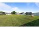 The large, fenced backyard provides privacy, ample space for recreation, and a trampoline for Gathering fun at 41 Liam Dr, Broadway, NC 27505