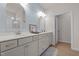 Bright bathroom with dual vanities, framed mirrors, and modern fixtures at 41 Liam Dr, Broadway, NC 27505