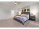 Inviting bedroom with a ceiling fan, carpeted floor, and a stylish bed at 41 Liam Dr, Broadway, NC 27505