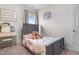 Charming bedroom featuring a floral patterned comforter and a wooden bed frame at 41 Liam Dr, Broadway, NC 27505