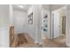 Welcoming entryway featuring wood-look floors, decorative accents, leading to an open hallway and bathroom at 41 Liam Dr, Broadway, NC 27505
