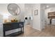 Inviting entryway with stylish furniture and view into the kitchen and laundry room for a modern feel at 41 Liam Dr, Broadway, NC 27505