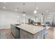 Spacious kitchen with granite countertops, stainless steel appliances, and an open floor plan at 41 Liam Dr, Broadway, NC 27505