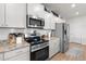 Modern kitchen with stainless steel appliances and white cabinets at 41 Liam Dr, Broadway, NC 27505