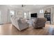 Bright living room showcasing ample seating, modern fixtures, and lots of natural light at 41 Liam Dr, Broadway, NC 27505