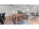 Spacious living room with wood-look floors, comfortable seating, and access to the kitchen at 41 Liam Dr, Broadway, NC 27505