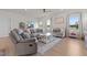 Relaxing living room with plush furniture, ceiling fan, and lots of natural light at 41 Liam Dr, Broadway, NC 27505
