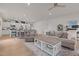 A cozy living room area featuring an open concept, ceiling fan, and neutral color palette at 41 Liam Dr, Broadway, NC 27505