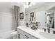 A bathroom with double vanity, toilet, and shower-tub combo at 426 Rowe Way, Knightdale, NC 27545