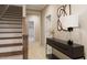 Inviting hallway with staircase and decorated console table at 426 Rowe Way, Knightdale, NC 27545