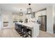 Bright, spacious kitchen with a large island, stainless steel appliances, and a view to the outside at 426 Rowe Way, Knightdale, NC 27545