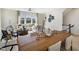 Open-concept living room featuring modern decor, large windows, and comfortable seating at 426 Rowe Way, Knightdale, NC 27545