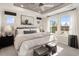 A serene main bedroom with ample natural light, a decorative ceiling, and stylish furnishings at 426 Rowe Way, Knightdale, NC 27545