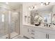 Modern bathroom featuring a glass-enclosed shower, dual sink vanity, and sleek fixtures at 430 Rowe Way, Knightdale, NC 27545