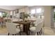 Cozy dining area with modern furniture set, flowing into a kitchen with stainless steel appliances at 430 Rowe Way, Knightdale, NC 27545
