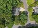 An aerial view of a home with lush green trees surrounding the house, offering a sense of privacy and seclusion at 6008 Chittim Ct, Raleigh, NC 27616