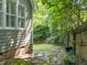 View of a charming backyard with green siding at 6008 Chittim Ct, Raleigh, NC 27616