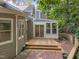 Spacious wooden deck adjoins a sunroom in this home's backyard at 6008 Chittim Ct, Raleigh, NC 27616
