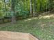 A sloped backyard features a retaining wall, providing a natural landscape at 6008 Chittim Ct, Raleigh, NC 27616