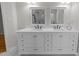 Bathroom with dual sinks, a white vanity, and granite countertops at 6008 Chittim Ct, Raleigh, NC 27616