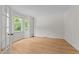 Bright bedroom with hardwood floors, large windows, and ample natural light, creating a welcoming space at 6008 Chittim Ct, Raleigh, NC 27616