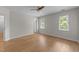 Spacious bedroom with two windows, ceiling fan, and neutral walls allowing for personalization at 6008 Chittim Ct, Raleigh, NC 27616