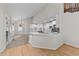 Modern kitchen with white cabinets, a kitchen island, sleek countertops, and lots of natural light at 6008 Chittim Ct, Raleigh, NC 27616