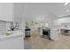 Open-concept kitchen with modern appliances, an island with cooktop, and easy access to the dining area at 6008 Chittim Ct, Raleigh, NC 27616