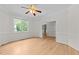The well-lit living room has elegant molding, hardwood floors, and a window for relaxing and entertaining at 6008 Chittim Ct, Raleigh, NC 27616