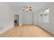 The well-lit living room has elegant molding, hardwood floors, and a bay window for relaxing and entertaining at 6008 Chittim Ct, Raleigh, NC 27616