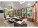 Bright sunroom with skylights, wood trim, and comfortable seating at 6008 Chittim Ct, Raleigh, NC 27616
