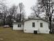 Exterior view of the back of the home and part of the backyard at 6908 Park Pl, Raleigh, NC 27616