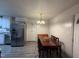Dining area features modern lighting and stainless steel appliances at 6908 Park Pl, Raleigh, NC 27616